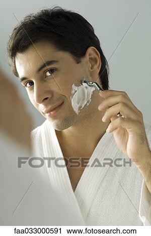 Man shaving, smiling at self in mirror View Large Photo Image Stock Image - Man shaving, smiling at self in mirror. Fotosearch