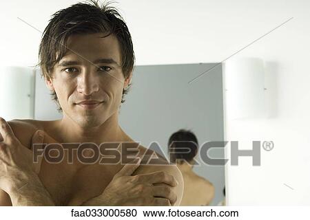 Man smiling at camera, arms folded across chest, portrait View Large Photo Image Stock Image - Man smiling at camera, arms folded across chest, portrait. Fotosearch