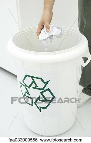 Man throwing crumpled paper in recycling bin, cropped view View Large Photo Image Stock Photograph - Man throwing crumpled paper in recycling bin, cropped view. Fotosearch