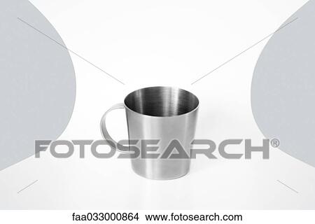 Picture - Metal cup on a chair, close-up. Fotosearch