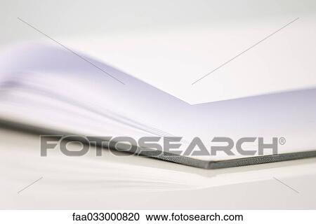 Stock Image - Open book with blank pages, close-up, cropped view. Fotosearch