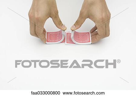 Pair of hands shuffling cards, cropped view View Large Photo Image Stock Image - Pair of hands shuffling cards, cropped view. Fotosearch