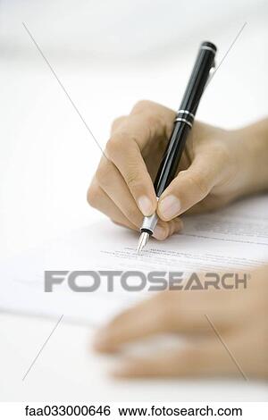 Person reviewing document, holding pen, cropped view of hands View Large Photo Image Stock Photograph - Person reviewing document, holding pen, cropped view of hands. Fotosearch