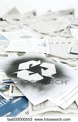 Recycling symbol stenciled on pile of newspapers View Large Photo Image Stock Image - Recycling symbol stenciled on pile of newspapers. Fotosearch