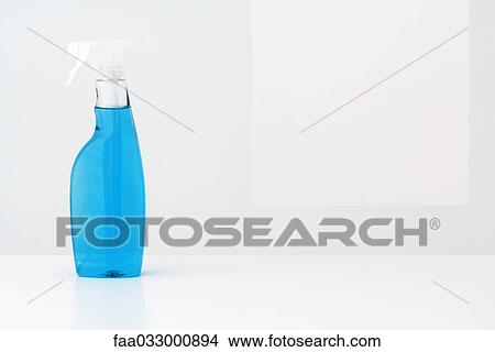 Picture - Spray bottle filled with blue cleaning fluid. Fotosearch
