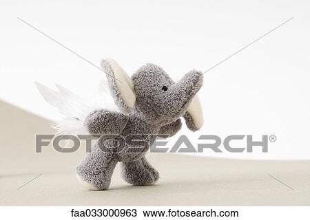 Stuffed elephant toy with wings trying to fly View Large Photo Image Stock Image - Stuffed elephant toy with wings trying to fly. Fotosearch