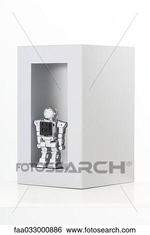 Toy robot standing inside of a block, rear view View Large Photo Image Stock Photograph - Toy robot standing inside of a block, rear view. Fotosearch