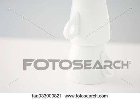 Stock Image - Two mugs stacked upside down, close-up. Fotosearch