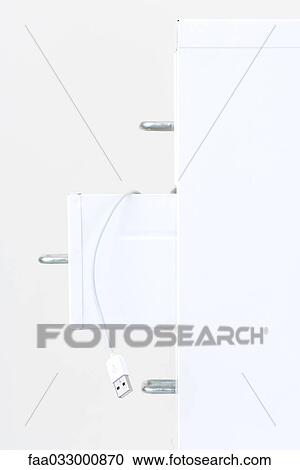 USB cable hanging from open drawer of a filing cabinet, close-up View Large Photo Image Stock Image - USB cable hanging from open drawer of a filing cabinet, close-up. Fotosearch