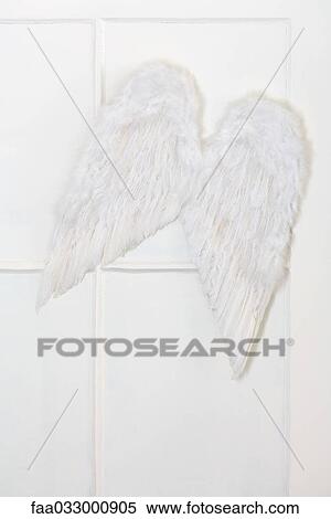 Stock Photography - Wings hanging in front of window pane. Fotosearch