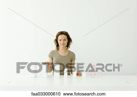 Woman with milk cartons and baby bottle, smiling at camera View Large Photo Image Stock Image - Woman with milk cartons and baby bottle, smiling at camera. Fotosearch
