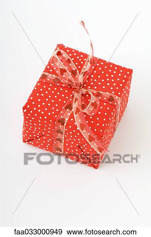 Wrapped gift, red and white polka dots View Large Photo Image Stock Photo - Wrapped gift, red and white polka dots. Fotosearch