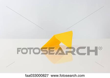 Yellow envelope propped up on table View Large Photo Image Stock Photo - Yellow envelope propped up on table. Fotosearch