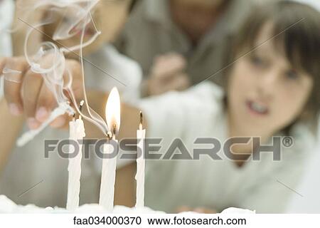 Boy reaching for candles on birthday cake, focus on foreground View Large Photo Image Stock Image - Boy reaching for candles on birthday cake, focus on foreground. Fotosearch