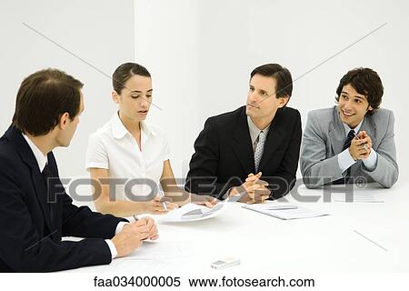 Business people in meeting listening to presentation View Large Photo Image Stock Photography - Business people in meeting listening to presentation. Fotosearch
