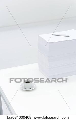 Coffee cup and large stack of documents on desk View Large Photo Image Stock Photo - Coffee cup and large stack of documents on desk. Fotosearch