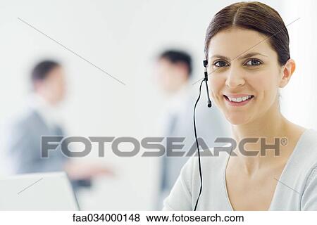 Female telemarketer smiling at camera, portrait View Large Photo Image Stock Photo - Female telemarketer smiling at camera, portrait. Fotosearch