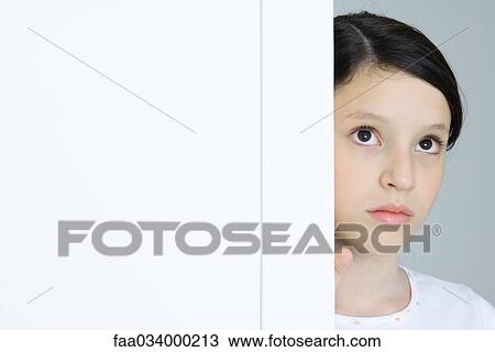Girl in doorway, looking up, close-up View Large Photo Image Stock Image - Girl in doorway, looking up, close-up. Fotosearch