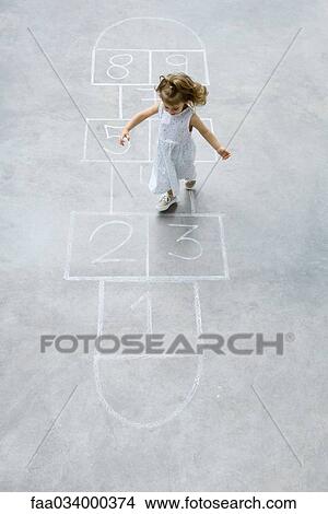 Picture - Little girl playing hopscotch, high angle view. Fotosearch