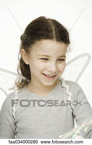 Little girl wearing wings, smiling, portrait View Large Photo Image Stock Image - Little girl wearing wings, smiling, portrait. Fotosearch