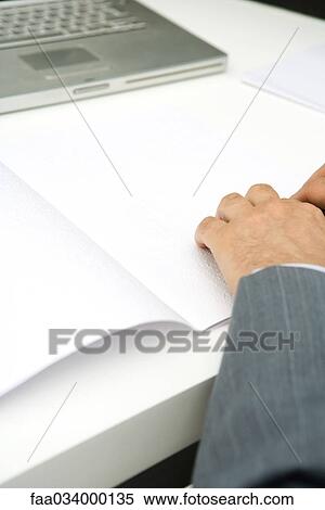 Man reading Braille document at desk, cropped view View Large Photo Image Stock Photography - Man reading Braille document at desk, cropped view. Fotosearch