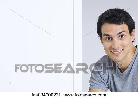 Stock Image - Man smiling at camera, portrait. Fotosearch