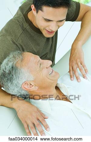 Picture - Mature man with adult son. Fotosearch