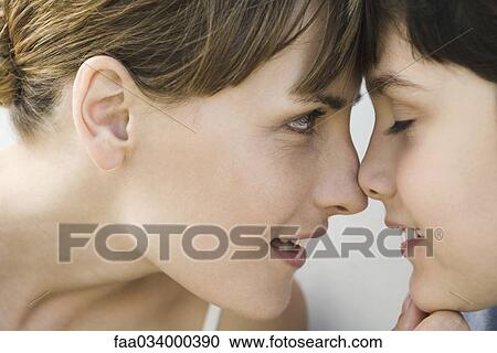 Mother and son touching noses, boy's eyes closed, side view View Large Photo Image Stock Image - Mother and son touching noses, boy's eyes closed, side view. Fotosearch