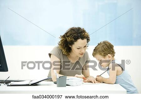 Mother and toddler son drawing together at desk, open agenda nearby View Large Photo Image Stock Photo - Mother and toddler son drawing together at desk, open agenda nearby. Fotosearch