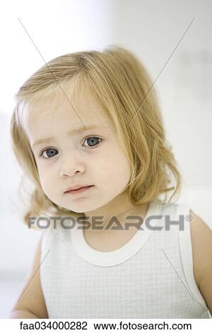 Toddler girl looking at camera, portrait View Large Photo Image Stock Image - Toddler girl looking at camera, portrait. Fotosearch