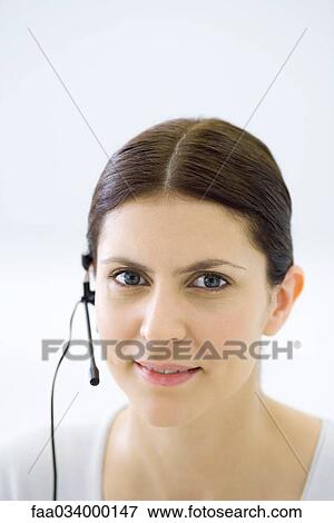 Woman wearing headset, portrait View Large Photo Image Stock Photo - Woman wearing headset, portrait. Fotosearch