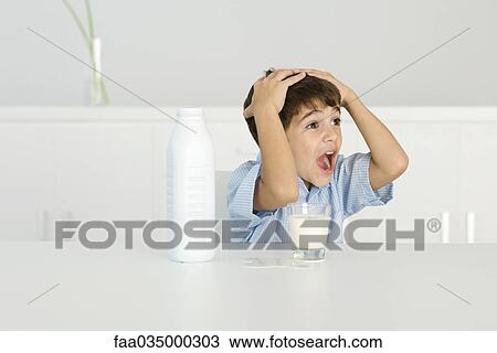 Boy with spilled milk, shouting, hands on head View Large Photo Image Stock Image - Boy with spilled milk, shouting, hands on head. Fotosearch