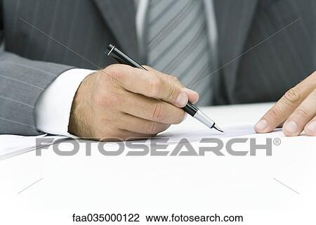 Businessman signing check, cropped view of hands View Large Photo Image Stock Image - Businessman signing check, cropped view of hands. Fotosearch