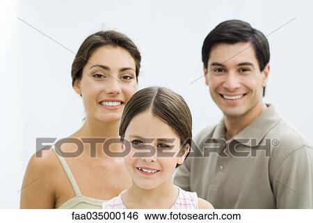 Stock Photograph - Family smiling at camera, portrait. Fotosearch