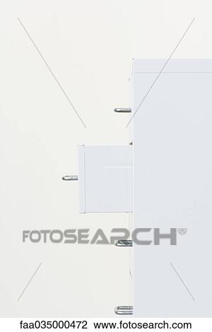 Filing cabinet with one drawer open, side view View Large Photo Image Stock Image - Filing cabinet with one drawer open, side view. Fotosearch