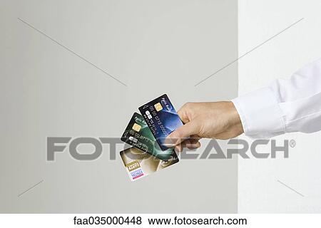 Hand holding several credit cards View Large Photo Image Stock Photo - Hand holding several credit cards. Fotosearch