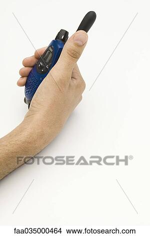 Hand holding walkie-talkie View Large Photo Image Picture - Hand holding walkie-talkie. Fotosearch