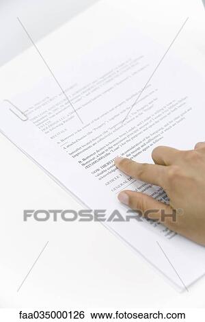 Hand pointing at word on document, cropped view View Large Photo Image Stock Photograph - Hand pointing at word on document, cropped view. Fotosearch
