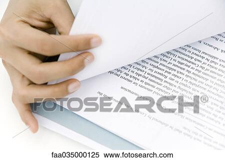 Hand turning document page, close-up View Large Photo Image Stock Photography - Hand turning document page, close-up. Fotosearch