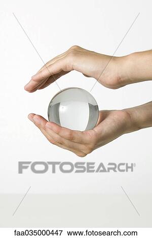 Hands holding crystal ball View Large Photo Image Stock Photo - Hands holding crystal ball. Fotosearch