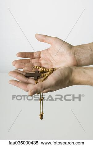 Hands holding rosary View Large Photo Image Stock Photography - Hands holding rosary. Fotosearch