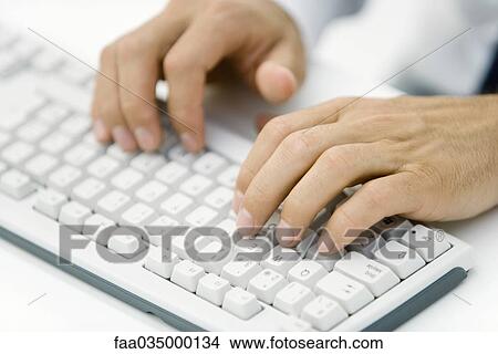 Hands typing on keyboard, cropped view View Large Photo Image Picture - Hands typing on keyboard, cropped view. Fotosearch