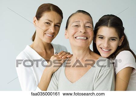 Multi-generational family smiling at camera, portrait View Large Photo Image Stock Image - Multi-generational family smiling at camera, portrait. Fotosearch