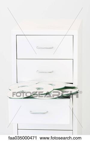 Open drawer overflowing with CDs View Large Photo Image Stock Image - Open drawer overflowing with CDs. Fotosearch