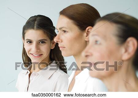Three generations of women, focus on teen girl smiling at camera View Large Photo Image Stock Image - Three generations of women, focus on teen girl smiling at camera. Fotosearch