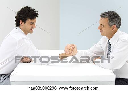 Two businessman arm wrestling View Large Photo Image Stock Photograph - Two businessman arm wrestling. Fotosearch