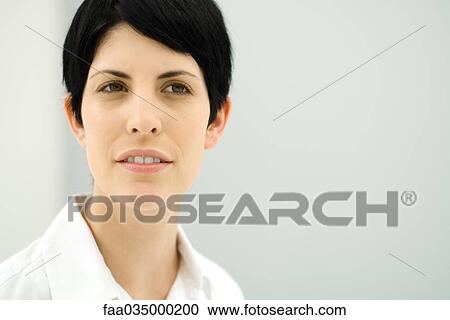 Stock Image - Woman looking away, portrait. Fotosearch