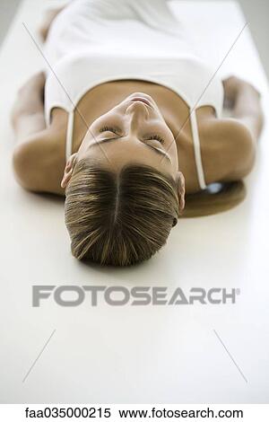 Woman lying on back, rear view View Large Photo Image Stock Photography - Woman lying on back, rear view. Fotosearch