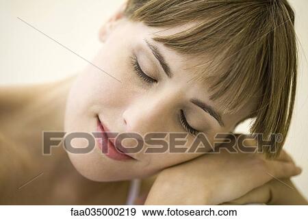 Woman resting head on shoulder, eyes closed View Large Photo Image Stock Photo - Woman resting head on shoulder, eyes closed. Fotosearch