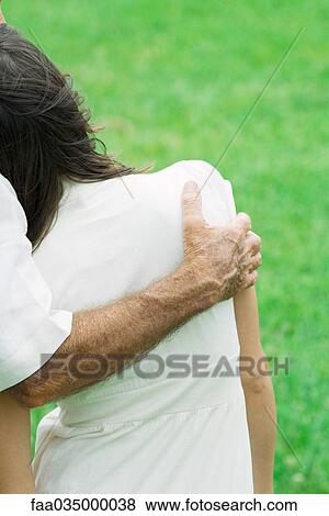 Young female leaning head on man's shoulder, cropped rear view View Large Photo Image Stock Photo - Young female leaning head on man's shoulder, cropped rear view. Fotosearch